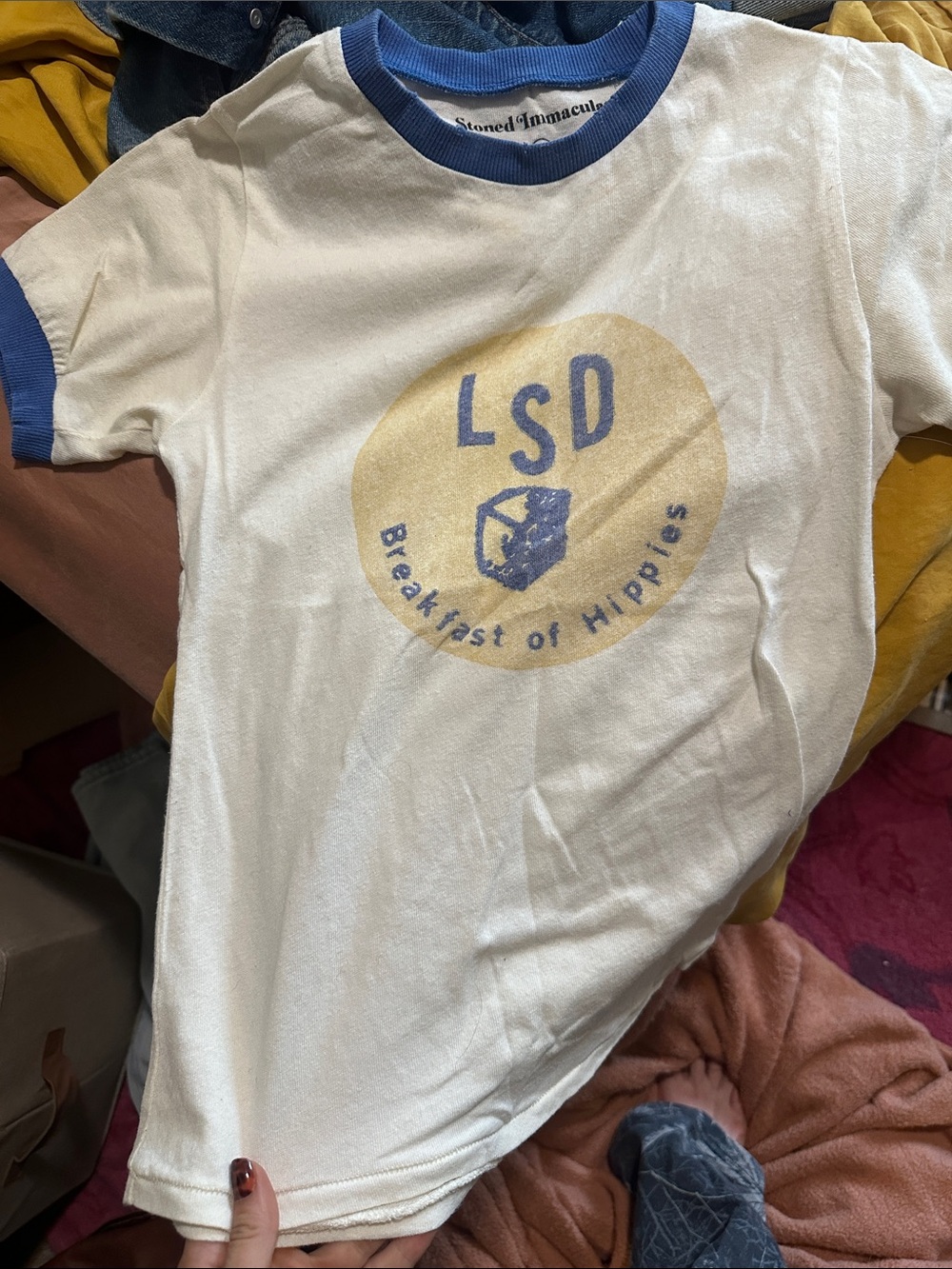 Stoned Immaculate White Tee with Blue Trim and Yellow Graphic